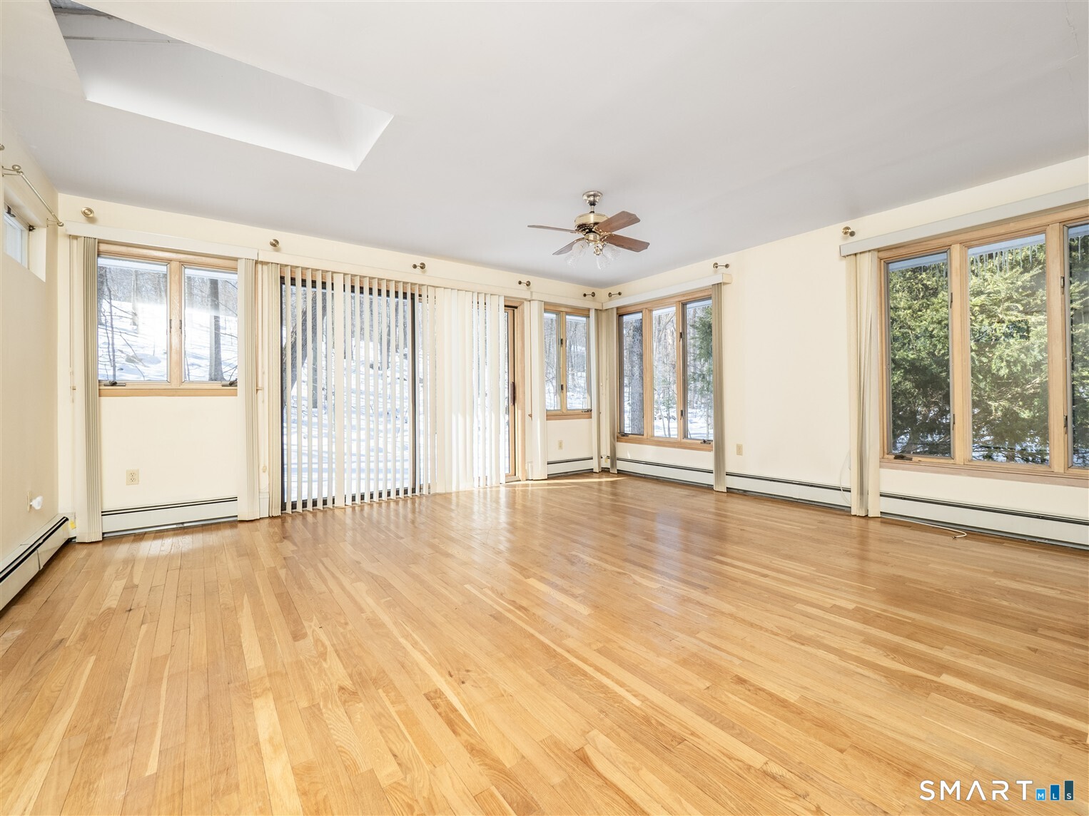 78 Ruscoe Road Wilton, CT 06897 - Photo 10 of 40 an empty room with wooden floor and windows
