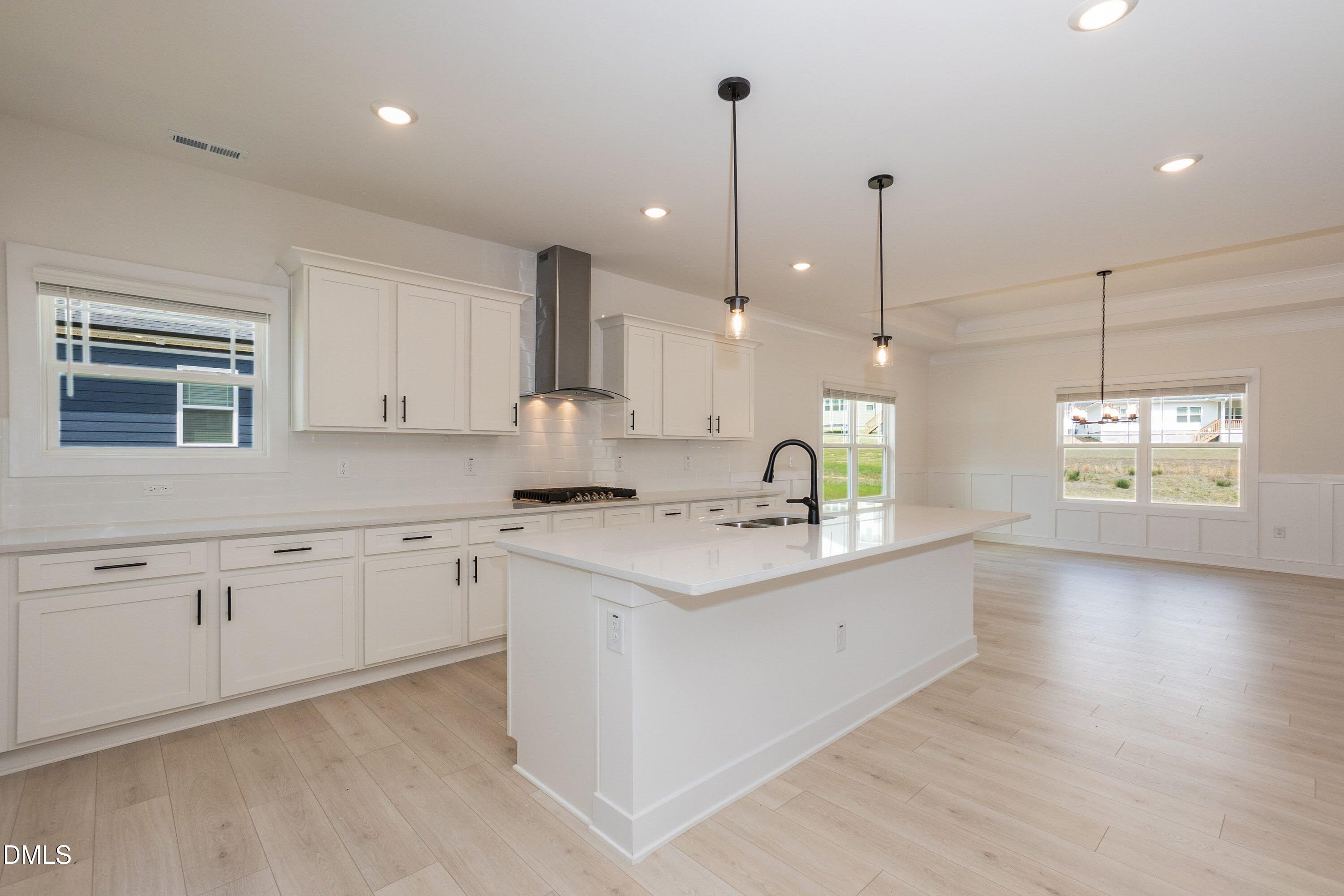 180 Galway Road Lillington, NC 27546 - Photo 12 of 41 a kitchen with a sink stove and cabinets