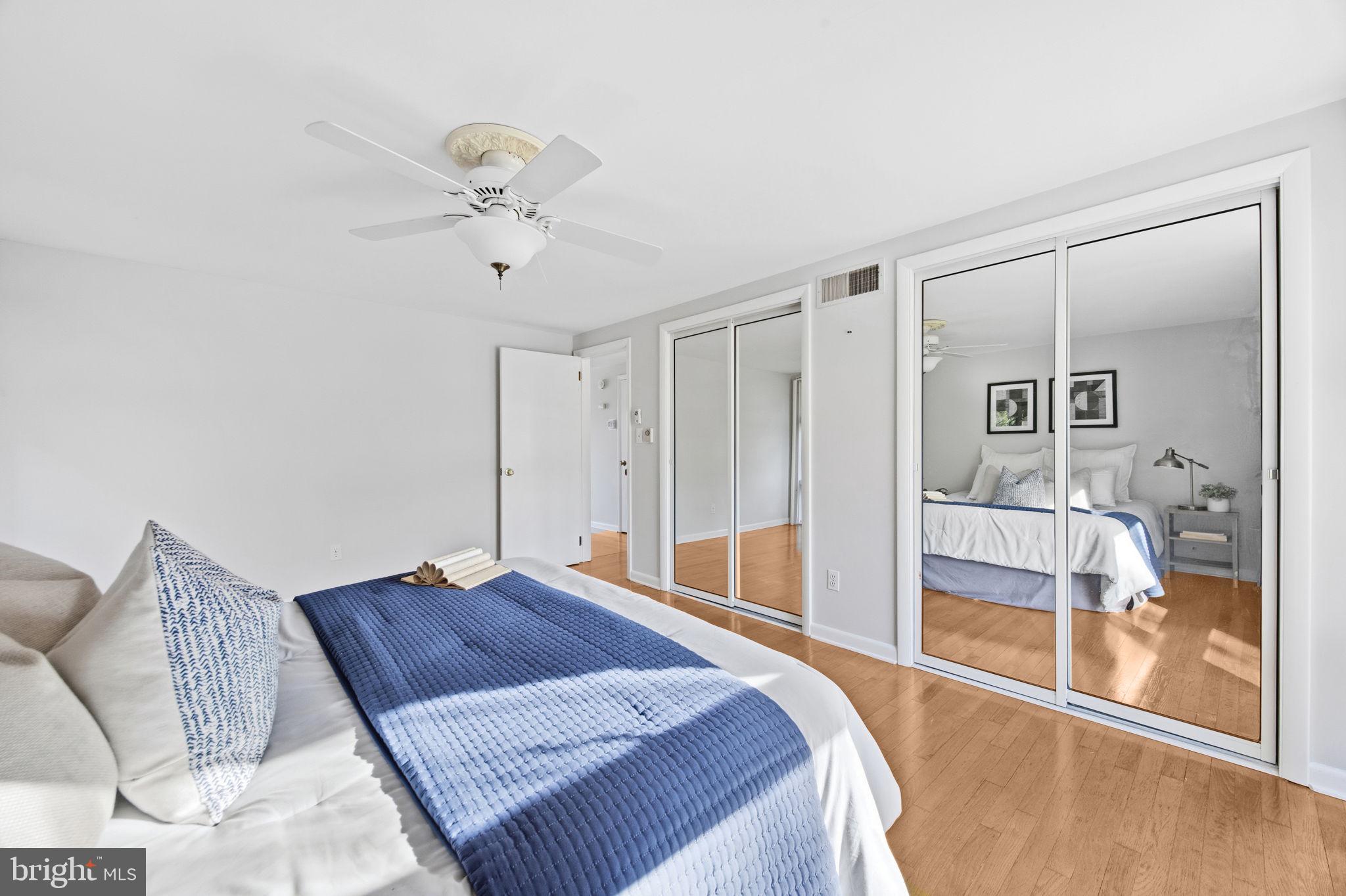 21315 Ridge Road Freeland, MD 21053 - Photo 26 of 69 a spacious bedroom with a bed and glass walk in closet
