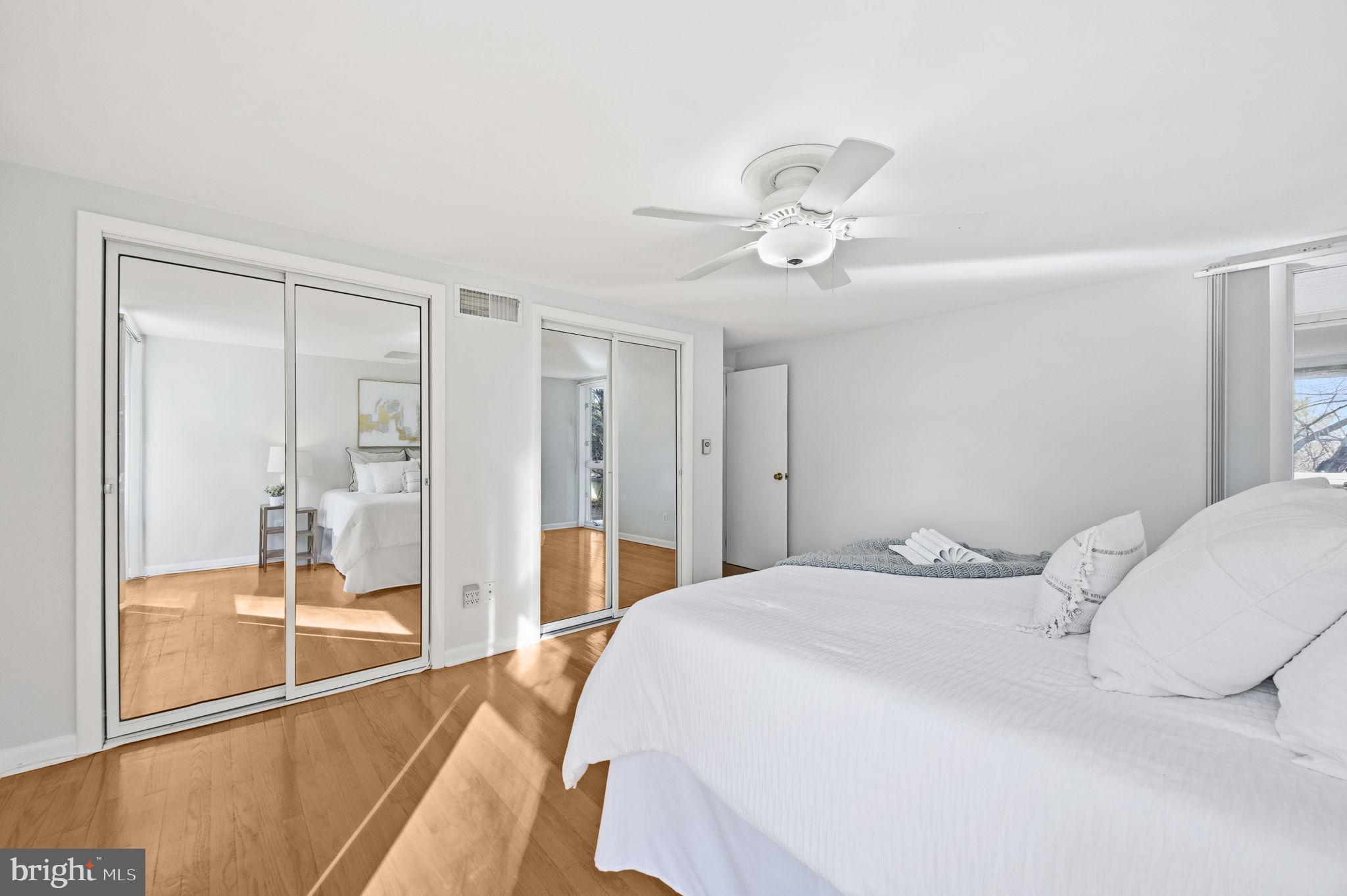21315 Ridge Road Freeland, MD 21053 - Photo 28 of 69 a spacious bedroom with a bed and a chandelier