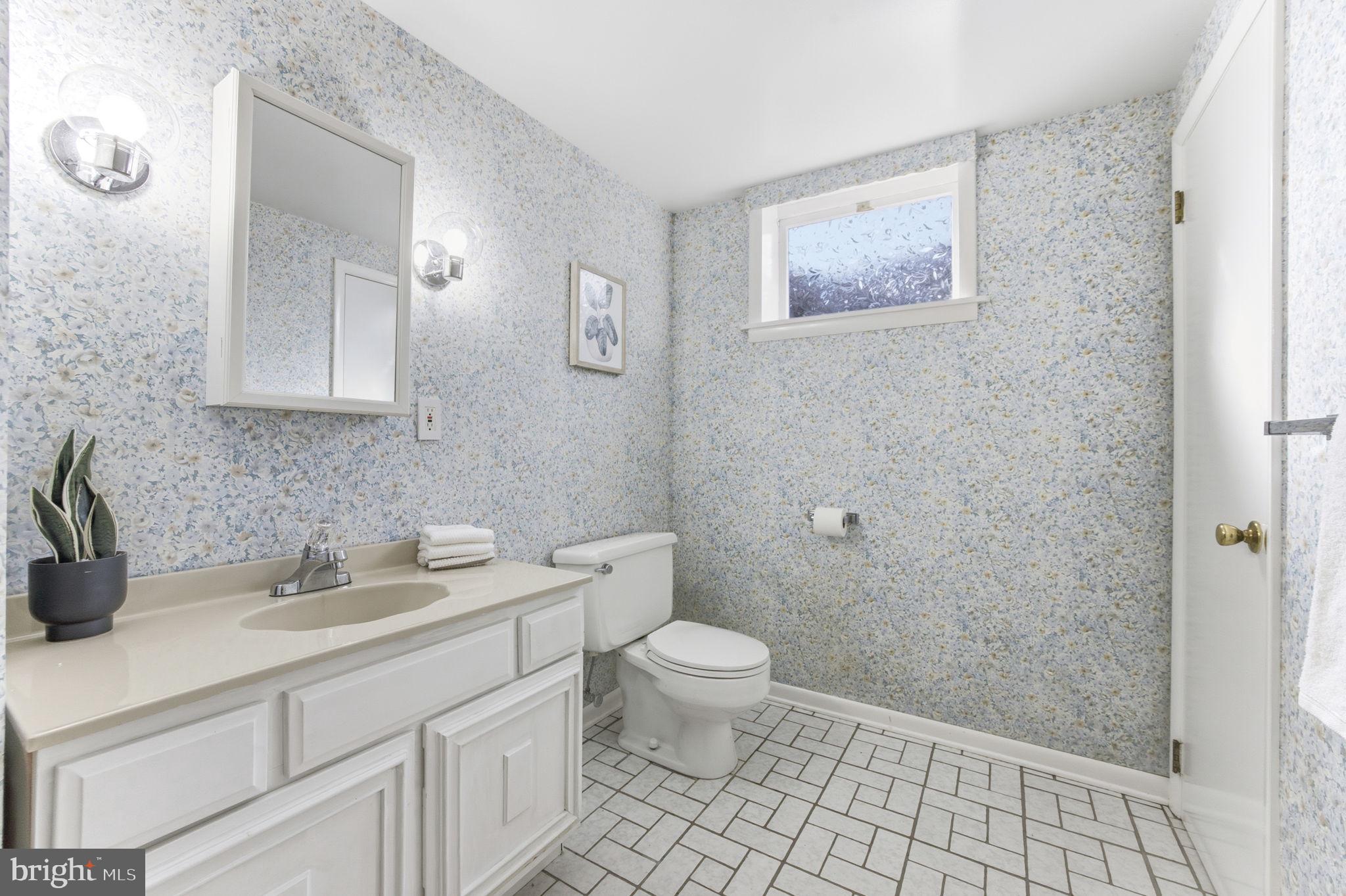 21315 Ridge Road Freeland, MD 21053 - Photo 40 of 69 a bathroom with a toilet sink and mirror
