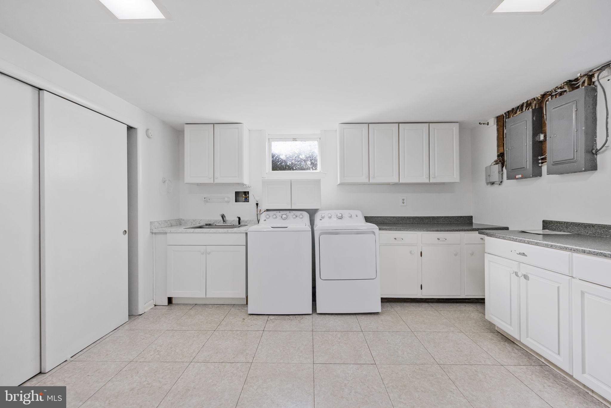 21315 Ridge Road Freeland, MD 21053 - Photo 43 of 69 a kitchen with white cabinets and white appliances