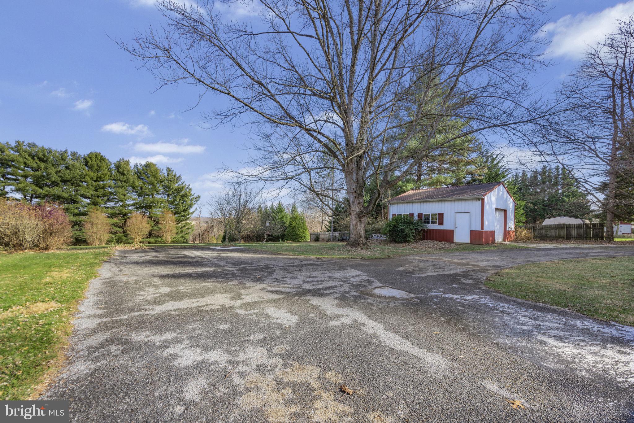 21315 Ridge Road Freeland, MD 21053 - Photo 52 of 69 a view of a house with yard and a trees