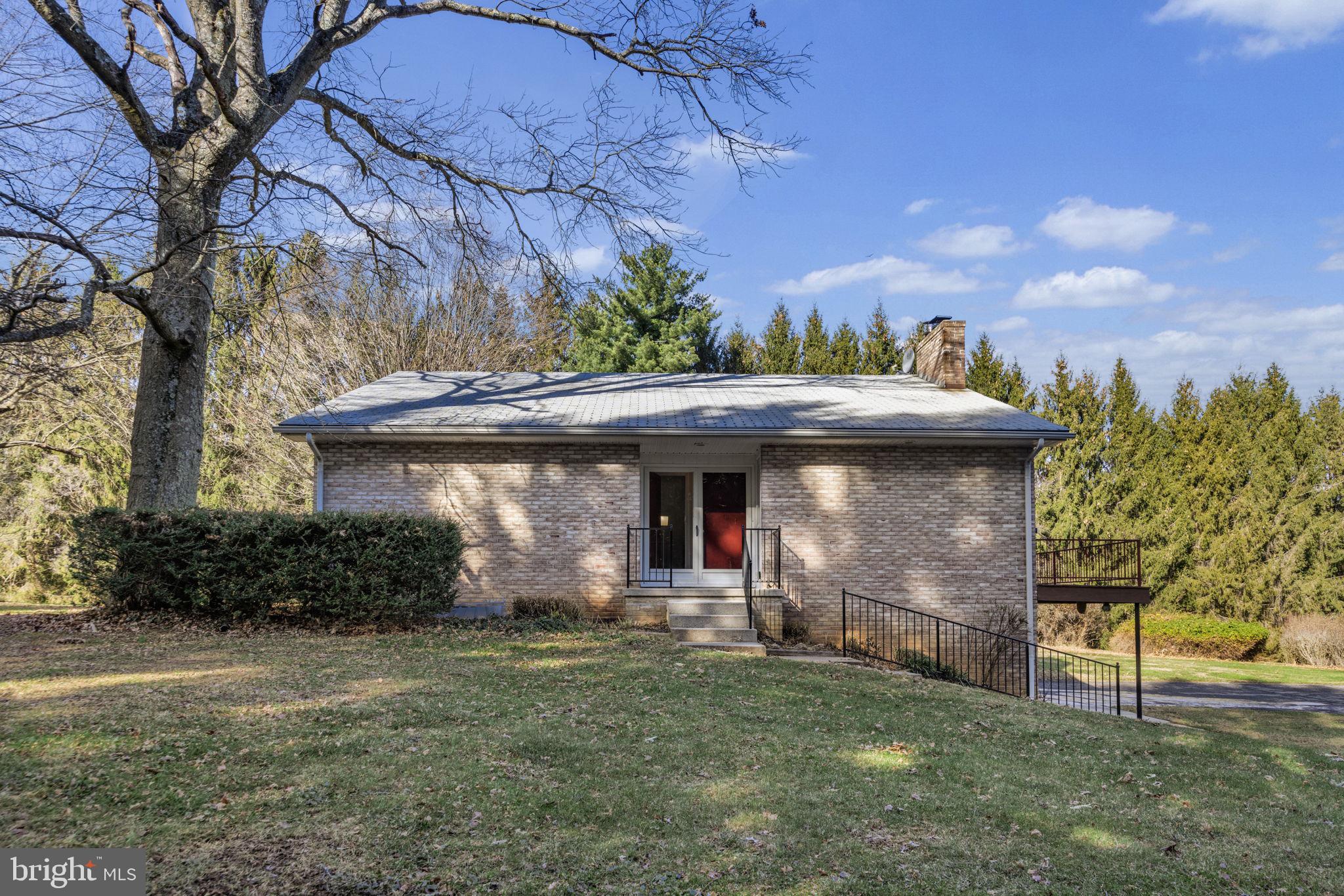 21315 Ridge Road Freeland, MD 21053 - Photo 6 of 69 a front view of a house with a garden