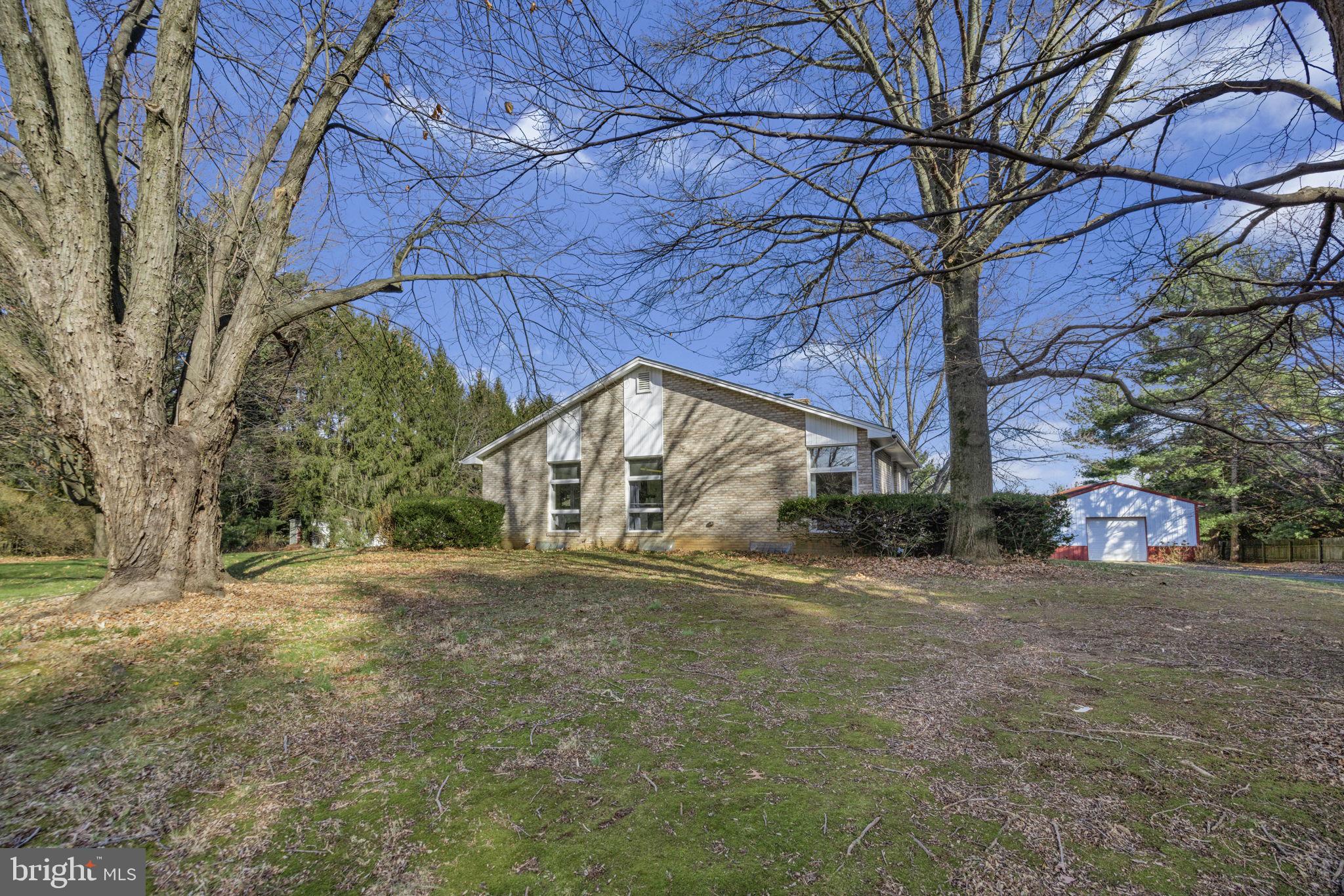 21315 Ridge Road Freeland, MD 21053 - Photo 68 of 69 a yellow house with a tree in front of it