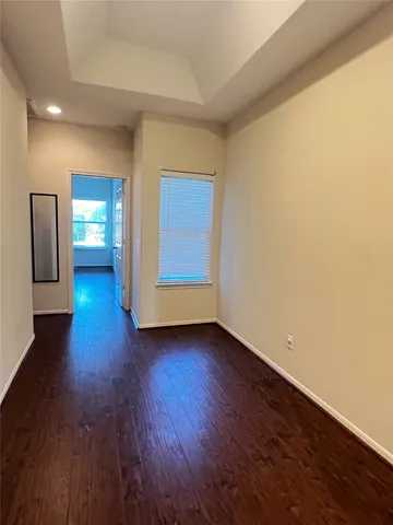 a view of a room with wooden floor and stairs