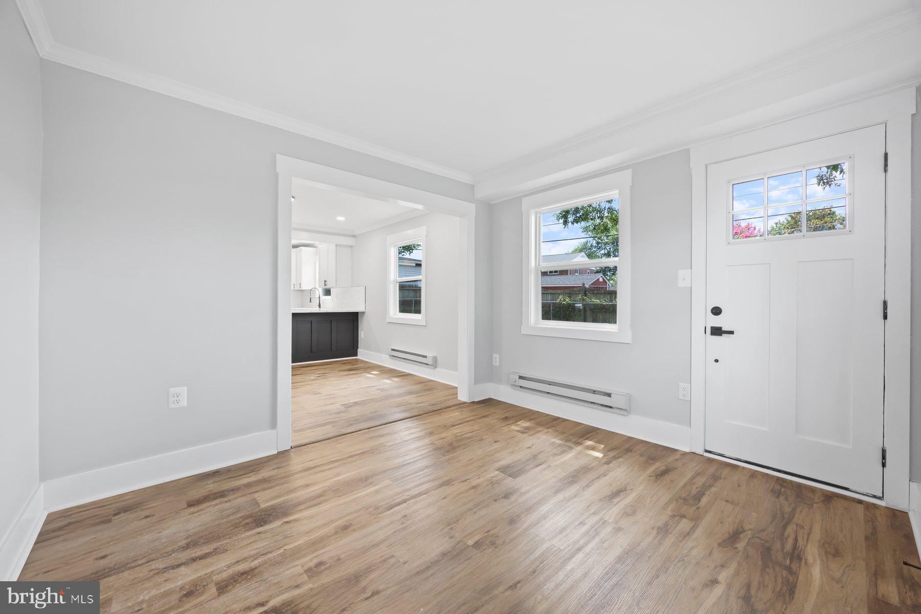 5915 Johnnycake Road Gwynn Oak, MD 21207 - Photo 24 of 35 a view of an empty room with window and wooden floor