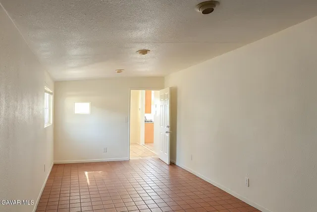 a view of an empty room and window