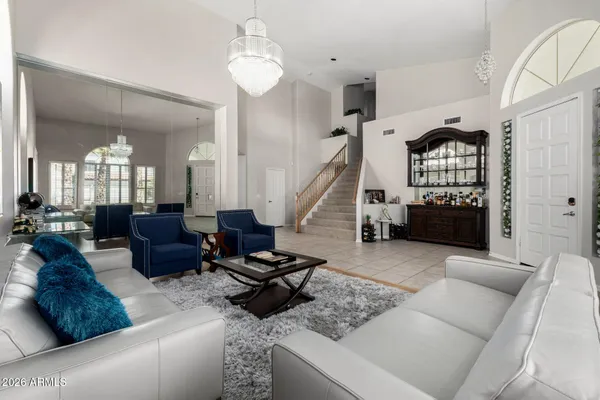 a living room with furniture and a large window