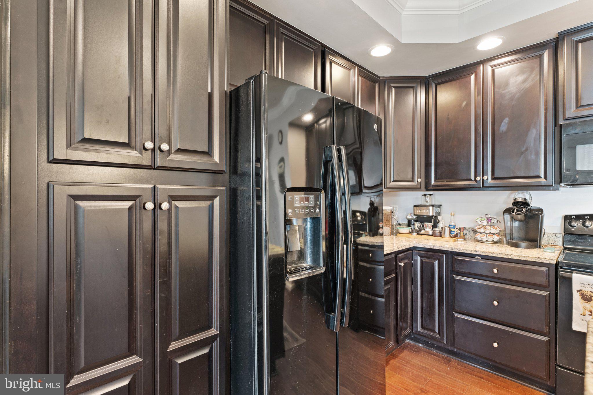 7494 Brunson Circle Gainesville, VA 20155 - Photo 16 of 49 a kitchen with stainless steel appliances granite countertop a refrigerator a stove and a sink
