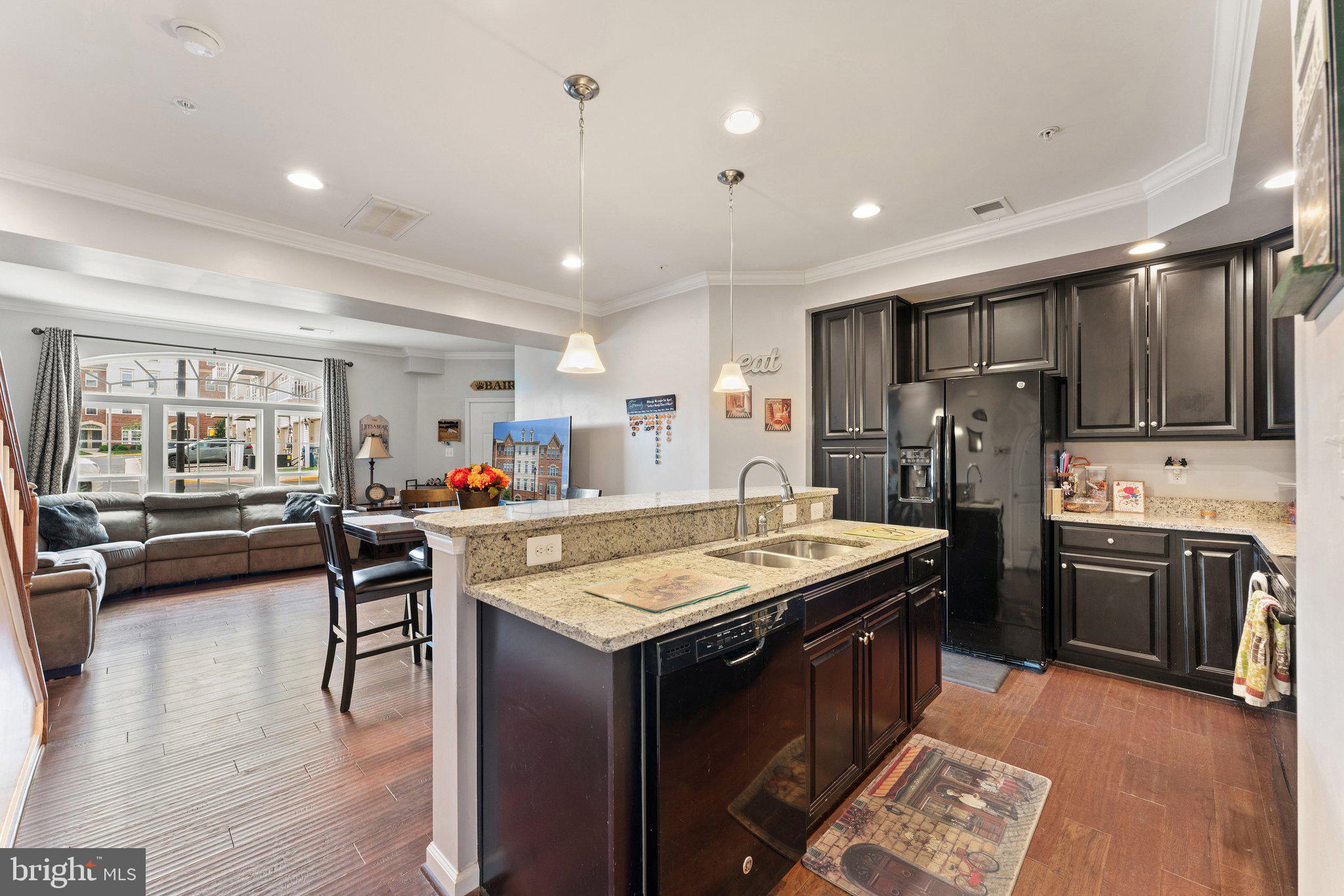 7494 Brunson Circle Gainesville, VA 20155 - Photo 24 of 49 a kitchen with stainless steel appliances granite countertop a stove refrigerator and a sink