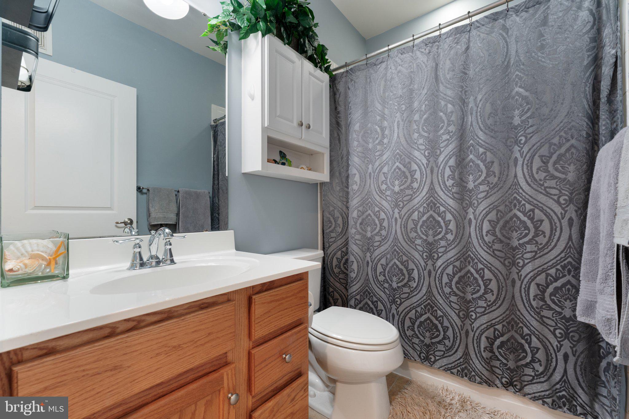 7494 Brunson Circle Gainesville, VA 20155 - Photo 26 of 49 a bathroom with a sink toilet and shower