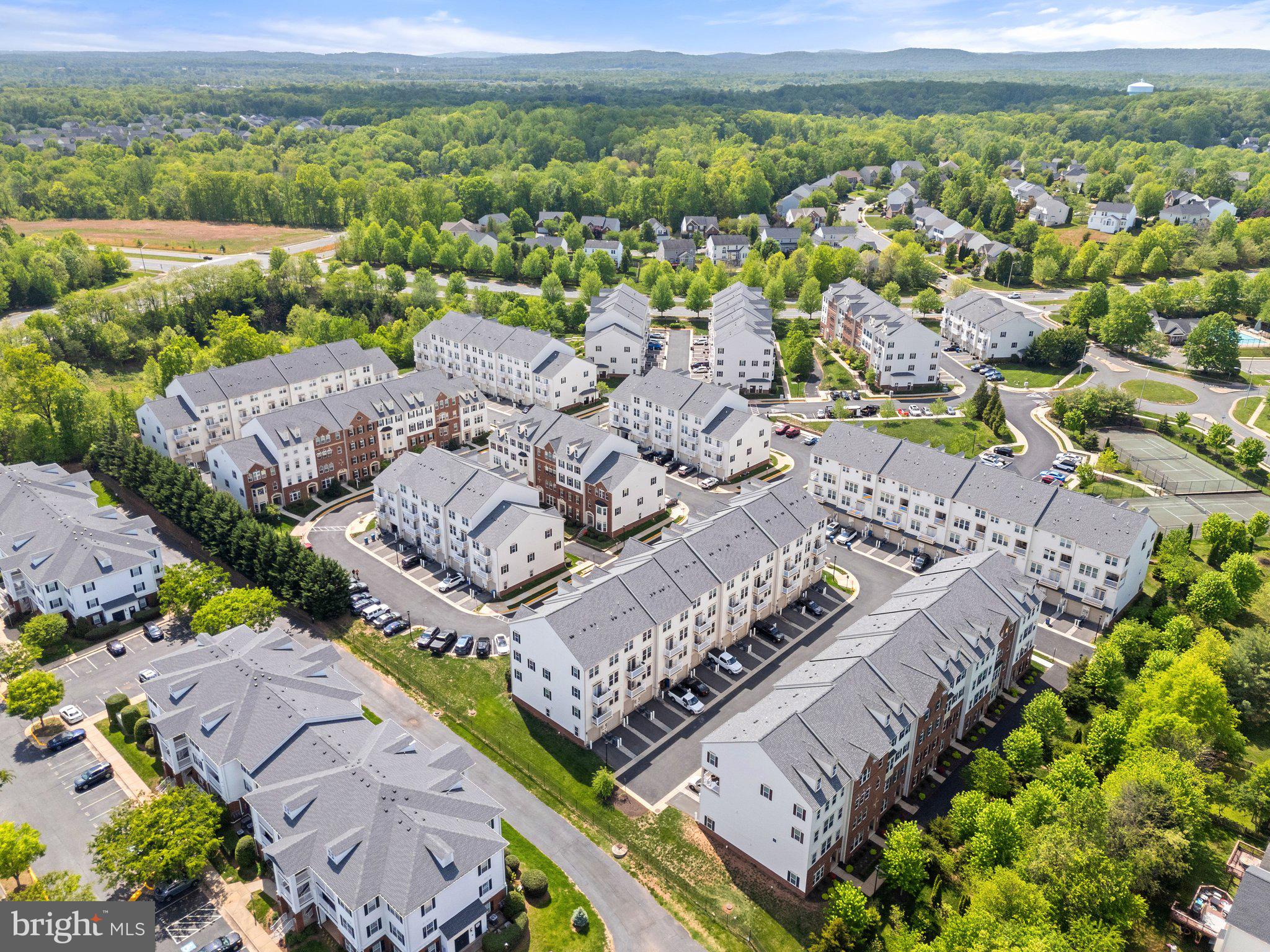 7494 Brunson Circle Gainesville, VA 20155 - Photo 3 of 49 an aerial view of a city with lots of residential buildings
