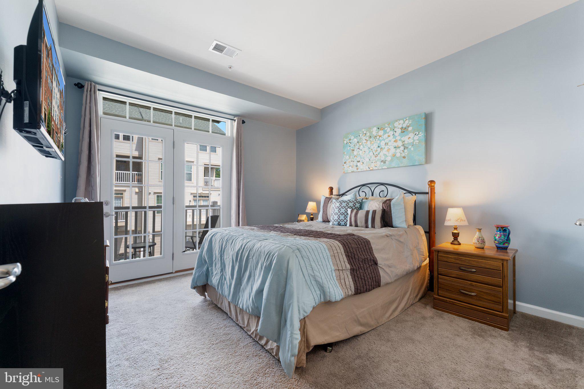 7494 Brunson Circle Gainesville, VA 20155 - Photo 34 of 49 a spacious bedroom with a bed and a cabinets