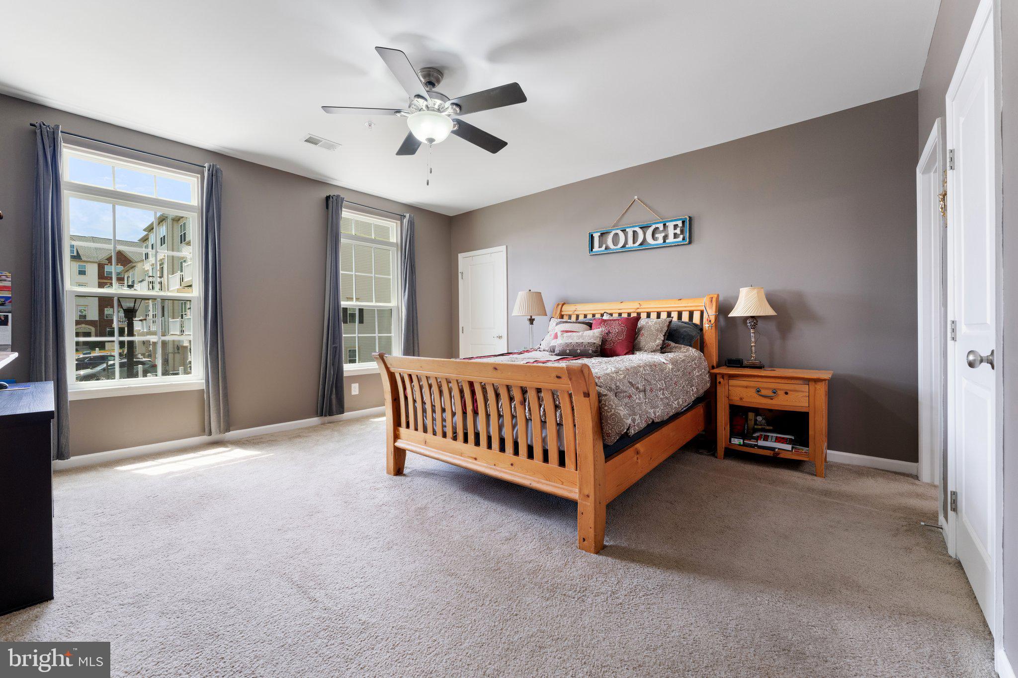 7494 Brunson Circle Gainesville, VA 20155 - Photo 39 of 49 a bedroom with a bed and a large window