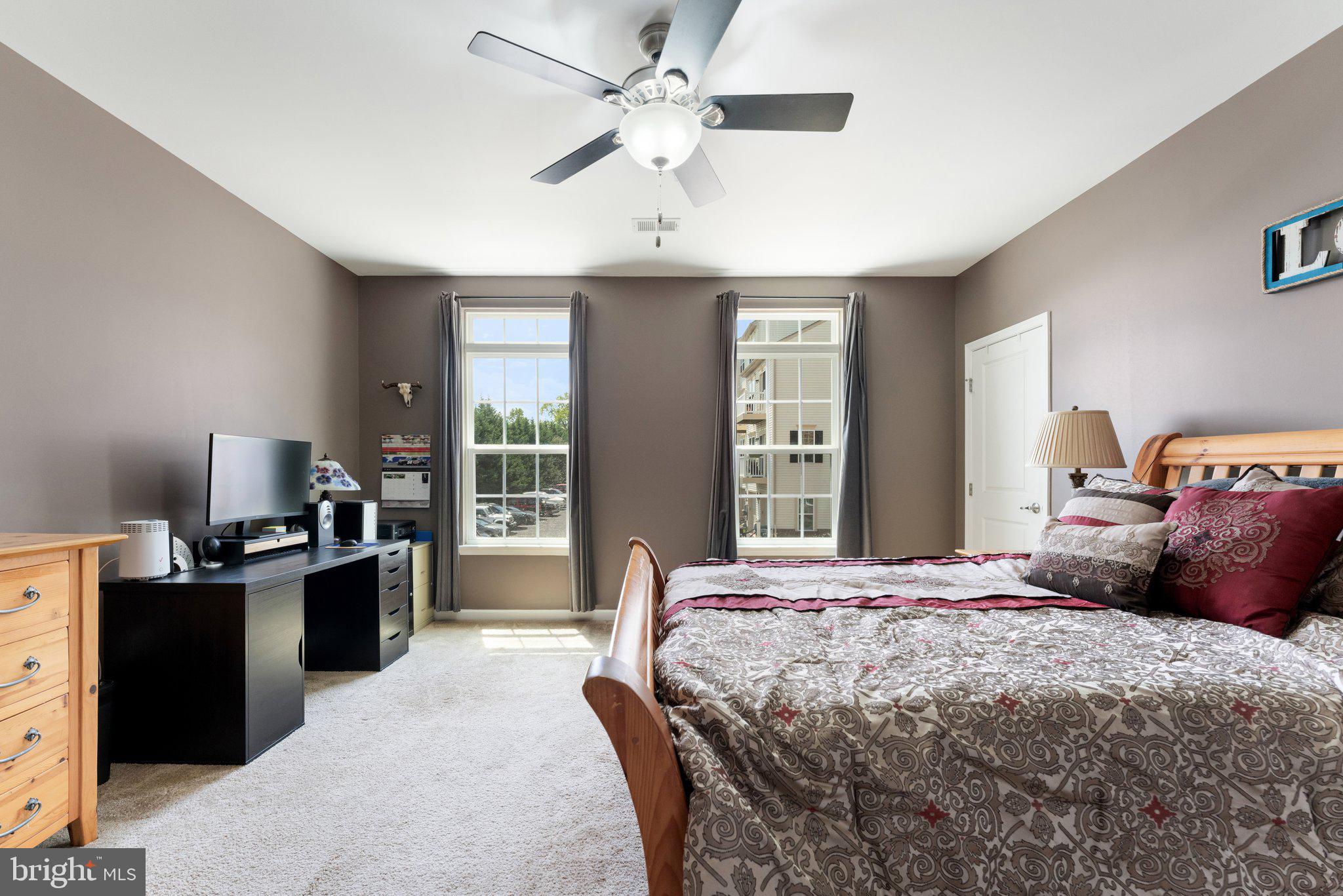 7494 Brunson Circle Gainesville, VA 20155 - Photo 40 of 49 a bedroom with a bed and a desk