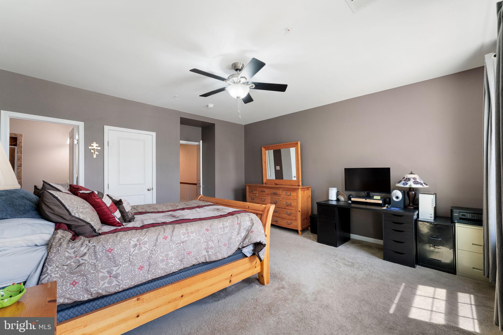 7494 Brunson Circle Gainesville, VA 20155 - Photo 45 of 49 a bedroom with a bed and a television