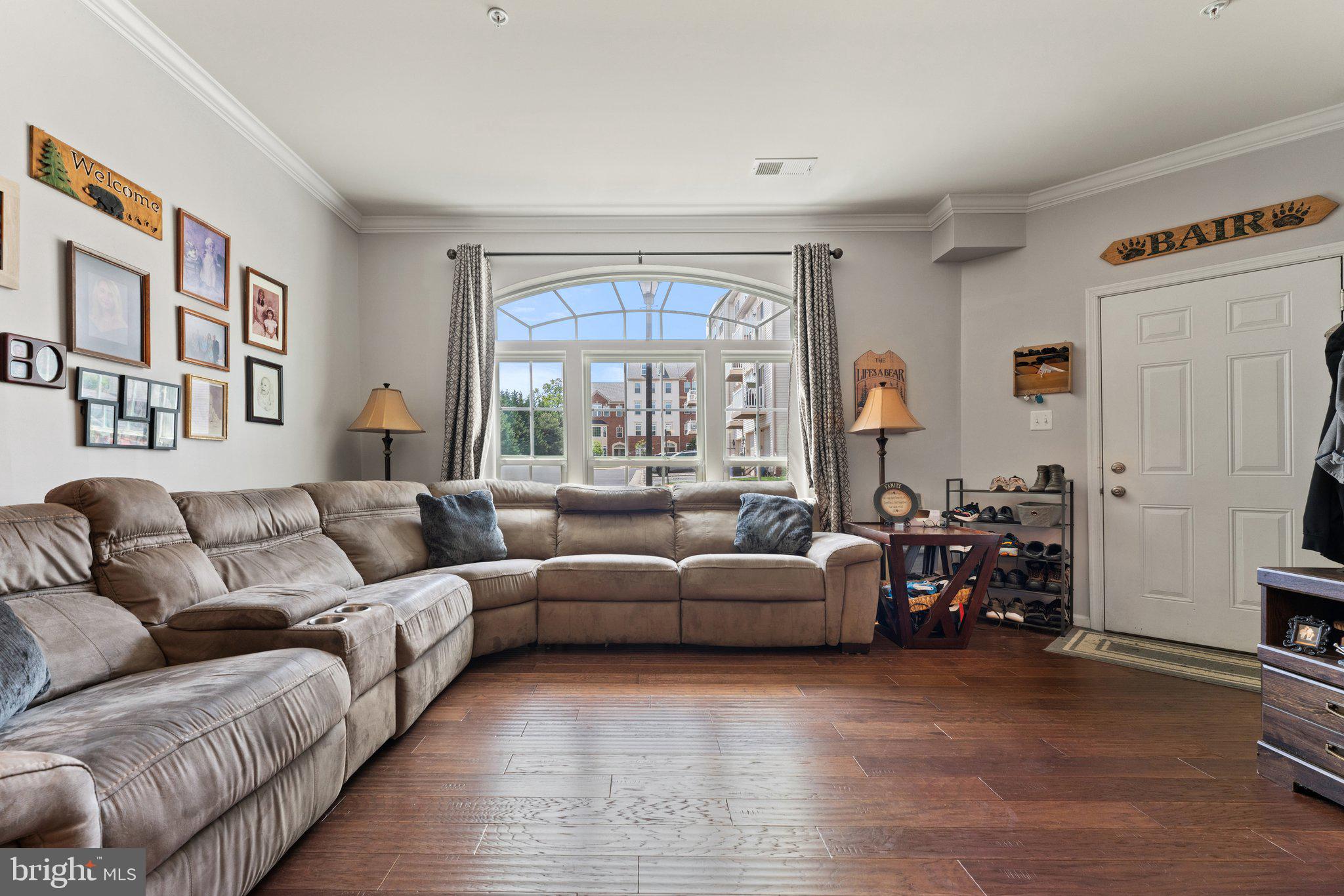 7494 Brunson Circle Gainesville, VA 20155 - Photo 10 of 49 a living room with furniture and a large window