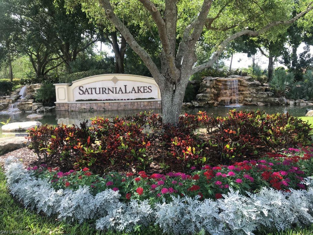 1357 Triandra Lane Naples, FL 34119 - Photo 1 of 40 a sign on the side of the road