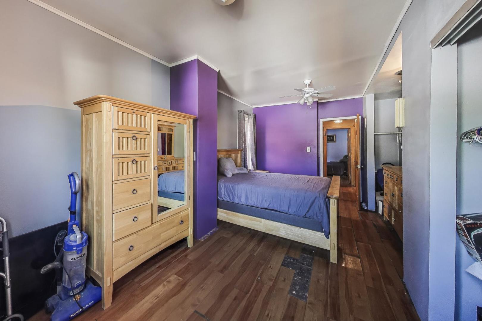 8346 South Aberdeen Street Chicago, IL 60620 - Photo 17 of 26 a view of bedroom with furniture and wooden floor