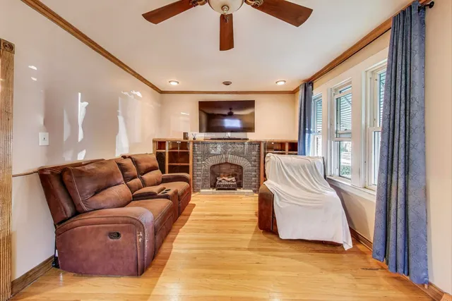 a living room with furniture and a fireplace