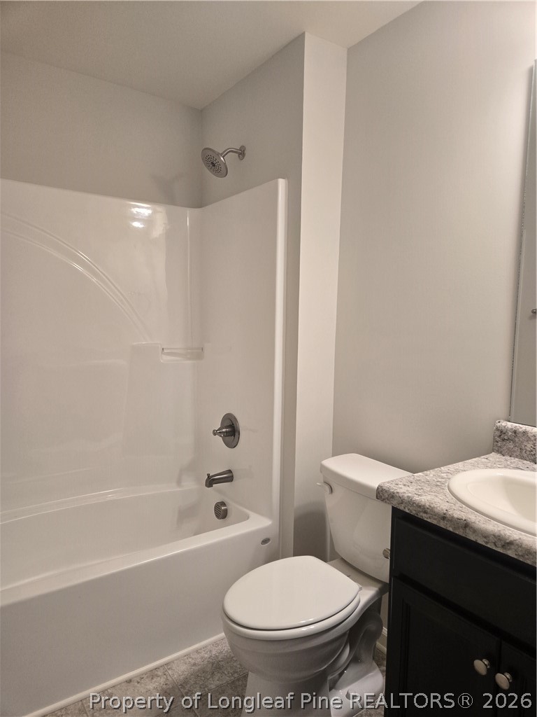 1354 East Manchester Road Spring Lake, NC 28390 - Photo 12 of 15 a bathroom with a granite countertop toilet sink and shower