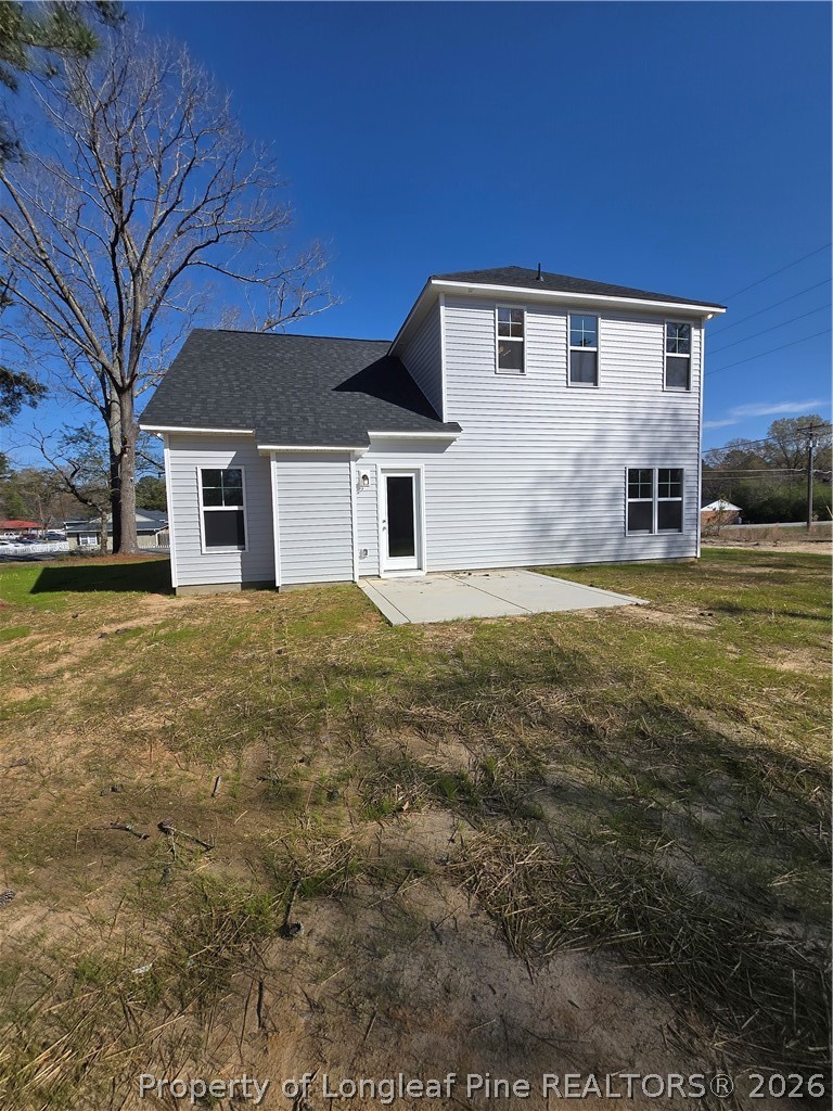 1354 East Manchester Road Spring Lake, NC 28390 - Photo 14 of 15 a house that has a big yard with large trees
