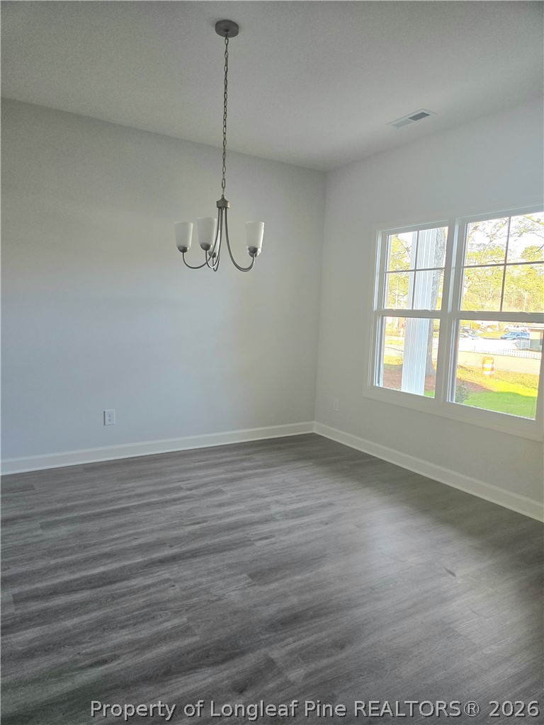 1354 East Manchester Road Spring Lake, NC 28390 - Photo 2 of 15 a view of a room with wooden floor and windows