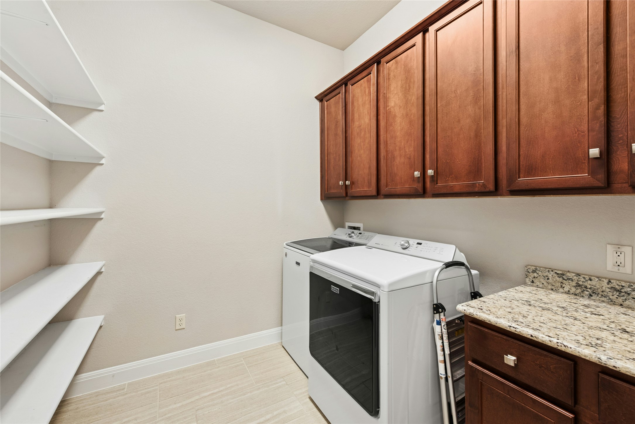 116 Evolutions Path Lakeway, TX 78738 - Photo 27 of 34 Laundry room featuring cabinet space and washing machine and clothes dryer