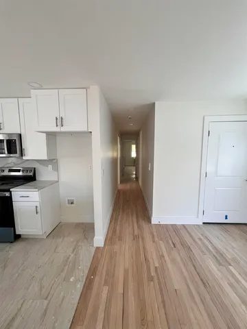 a view of kitchen with wooden floor