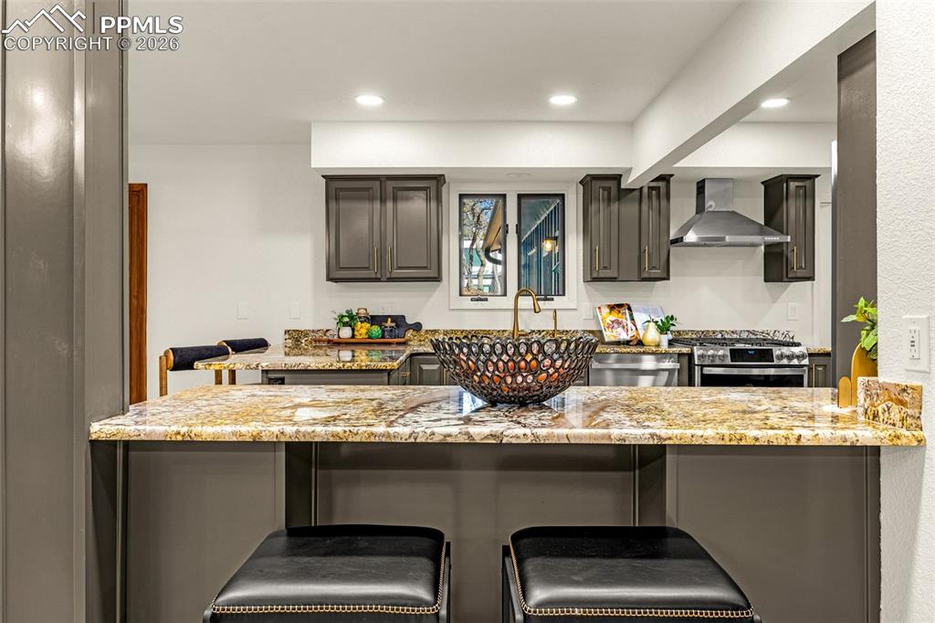 26 Leaming Road Colorado Springs, CO 80906 - Photo 11 of 45 a kitchen with a sink and a refrigerator