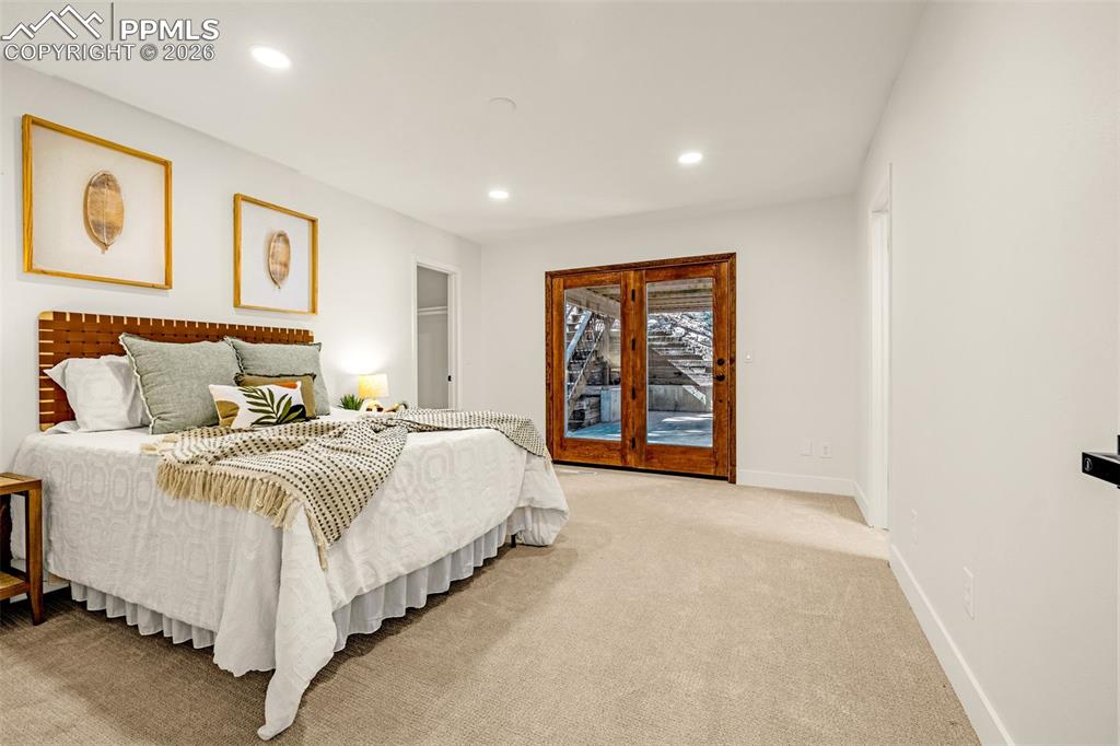 26 Leaming Road Colorado Springs, CO 80906 - Photo 37 of 45 a spacious bedroom with a bed and a window