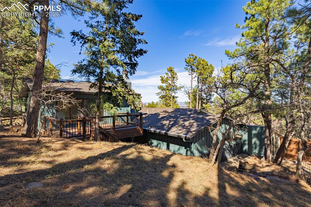 26 Leaming Road Colorado Springs, CO 80906 - Photo 41 of 45 a wooden bench with a tree