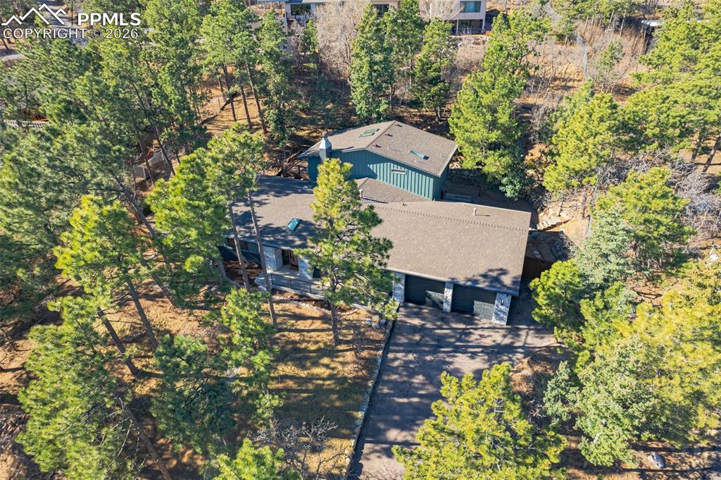26 Leaming Road Colorado Springs, CO 80906 - Photo 45 of 45 an aerial view of a house with a garden and lake view