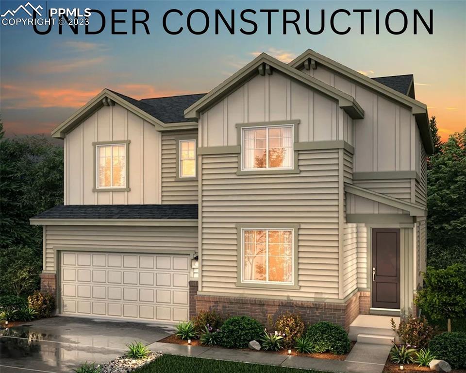 a view of a house with a yard and garage