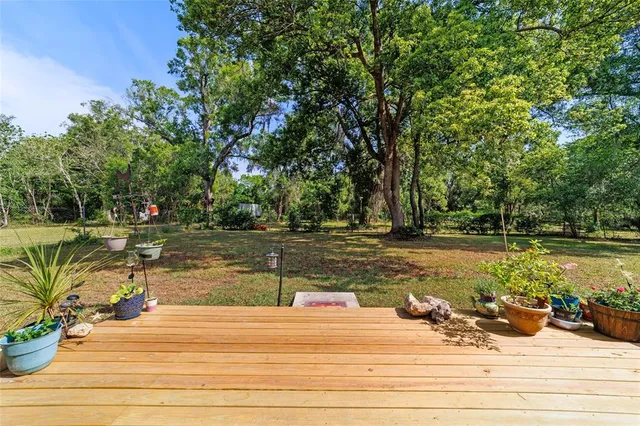 a view of a bedroom with furniture and window