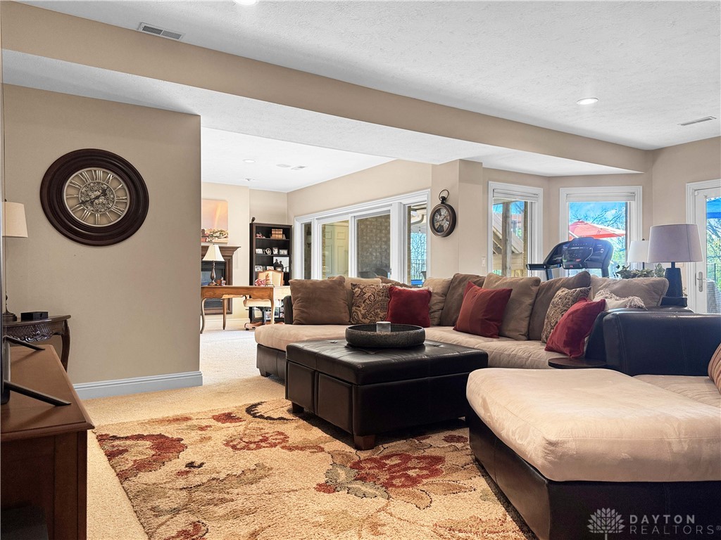 4096 Middle Urbana Road Urbana, OH 43078 - Photo 36 of 96 This family room offers comfort and ample natural light through large windows and sliding doors.