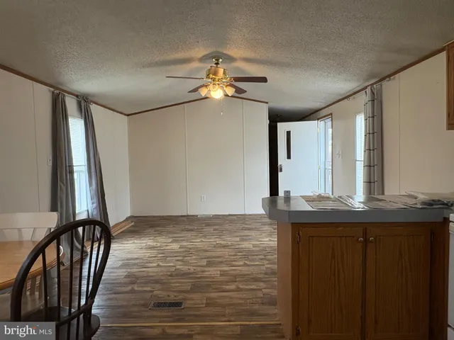 a view of a kitchen with a sink and cabinet area