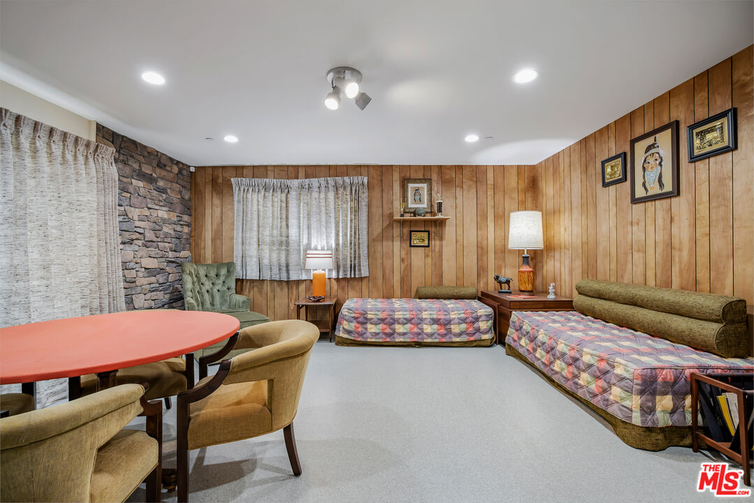 11222 Dilling Street Studio City, CA 91602 - Photo 14 of 30 a bedroom with a bed and a table