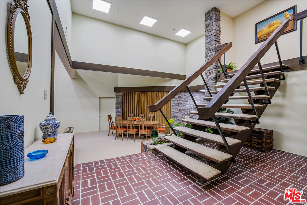 11222 Dilling Street Studio City, CA 91602 - Photo 17 of 30 a view of entryway with wooden floor and a rug