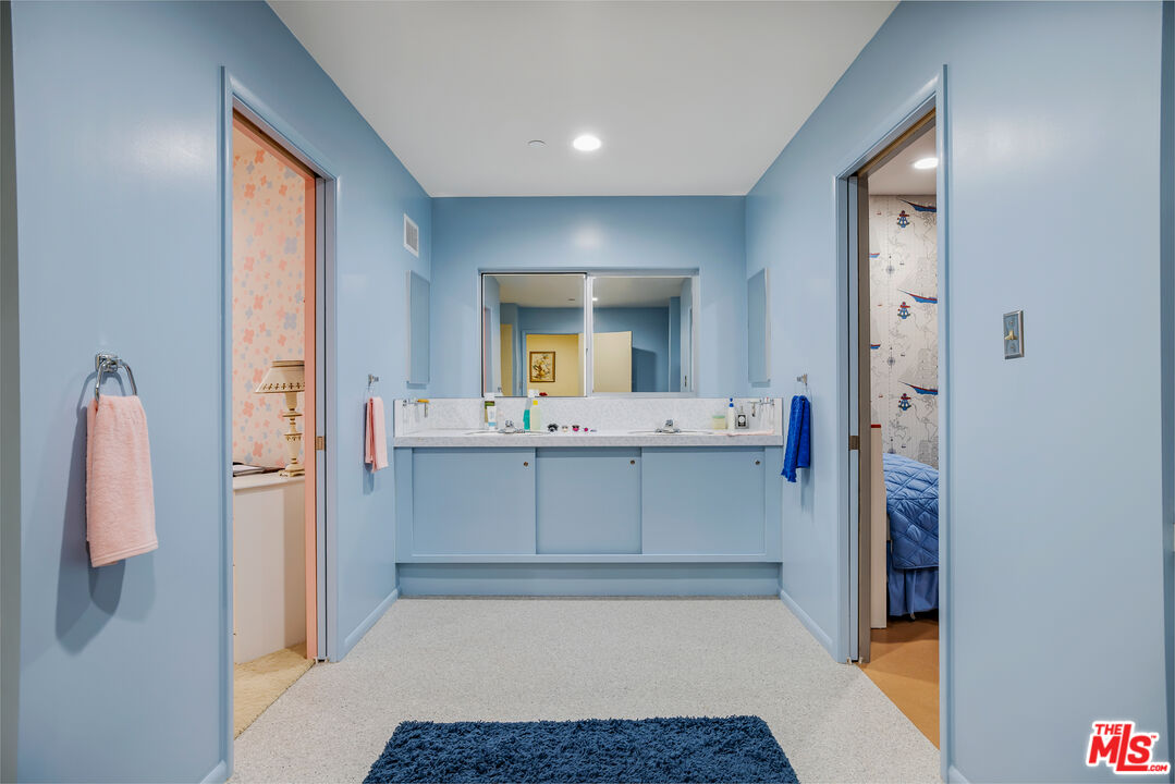 11222 Dilling Street Studio City, CA 91602 - Photo 20 of 30 a bathroom with a sink and a mirror