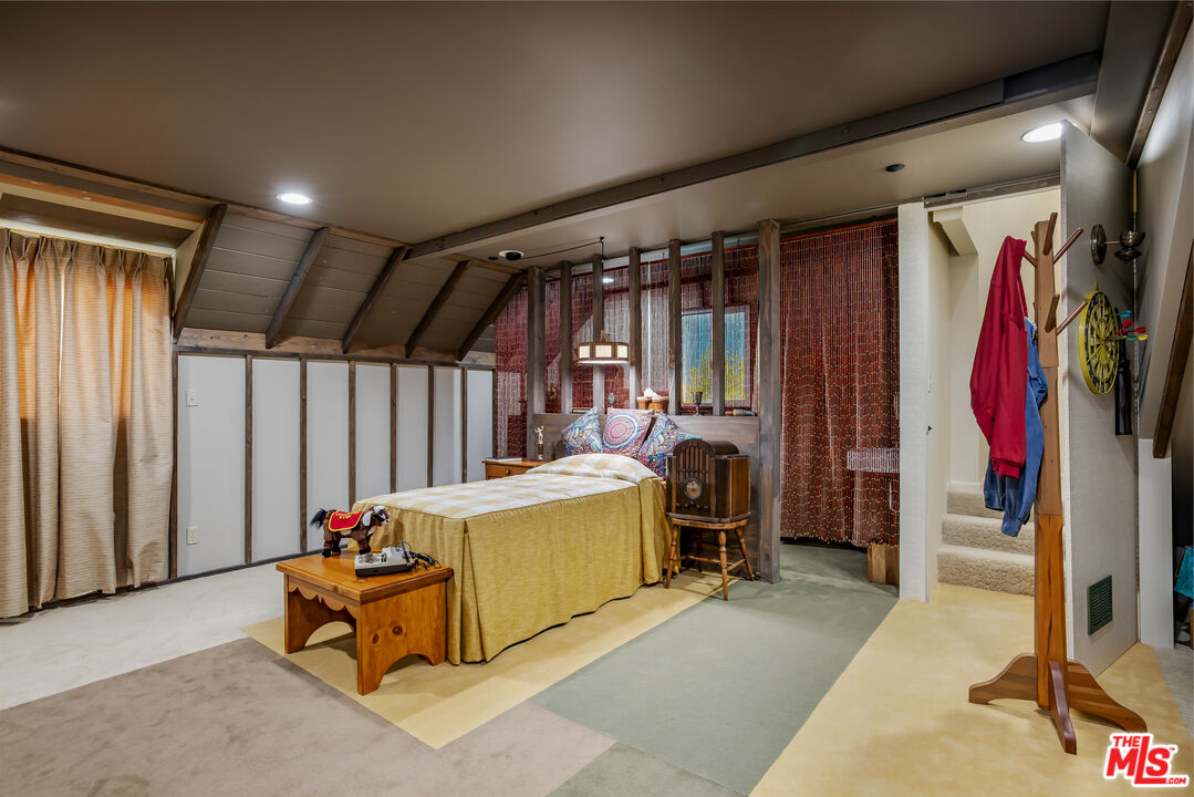 11222 Dilling Street Studio City, CA 91602 - Photo 27 of 30 a bed room with a bed and a chair