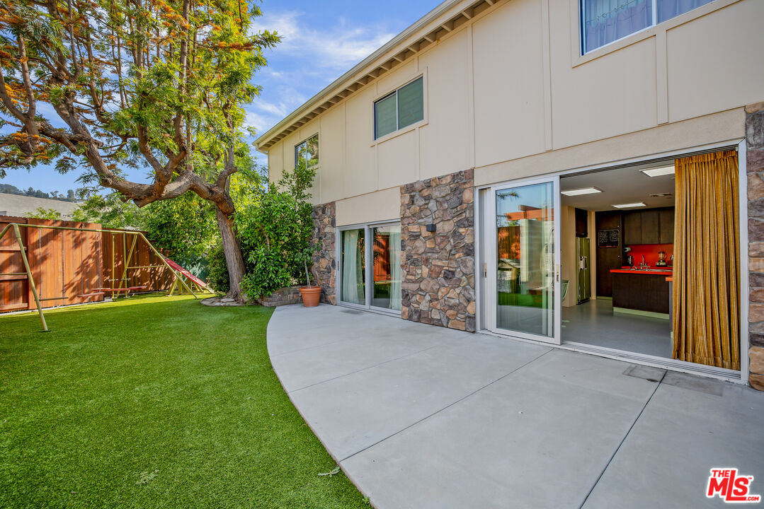 11222 Dilling Street Studio City, CA 91602 - Photo 28 of 30 a view of a house with a yard and potted plants