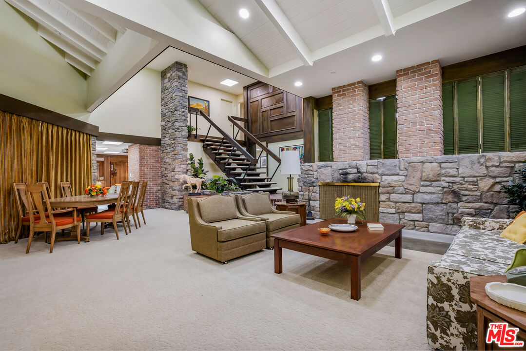 11222 Dilling Street Studio City, CA 91602 - Photo 5 of 30 a living room with furniture and a fireplace