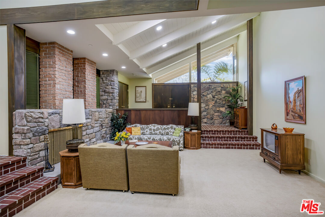 11222 Dilling Street Studio City, CA 91602 - Photo 8 of 30 a living room with furniture and a floor to ceiling window