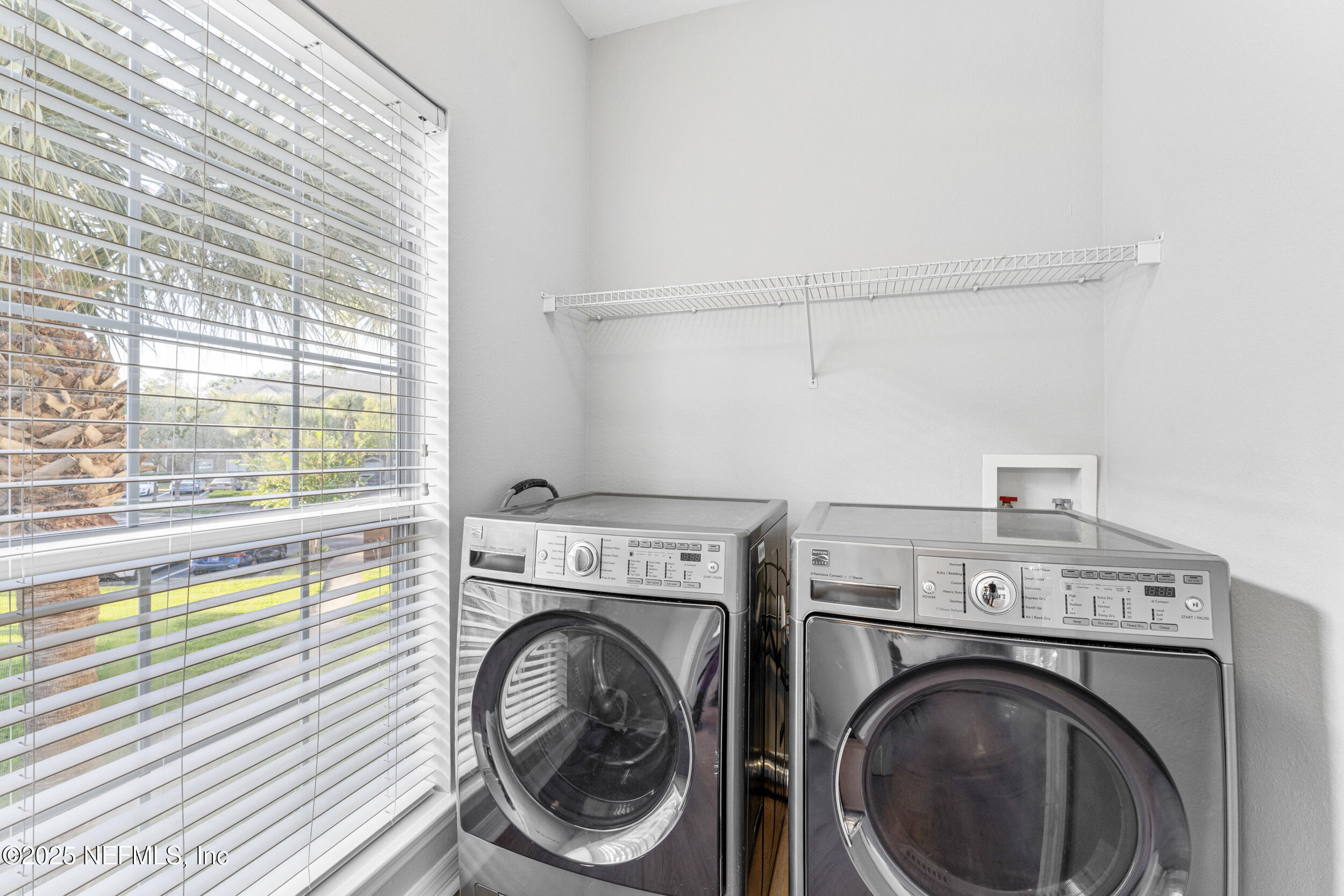 10961 Burnt Mill Road, Unit 621 Jacksonville, FL 32256 - Photo 16 of 19 a view of storage and utility room with washer and dryer