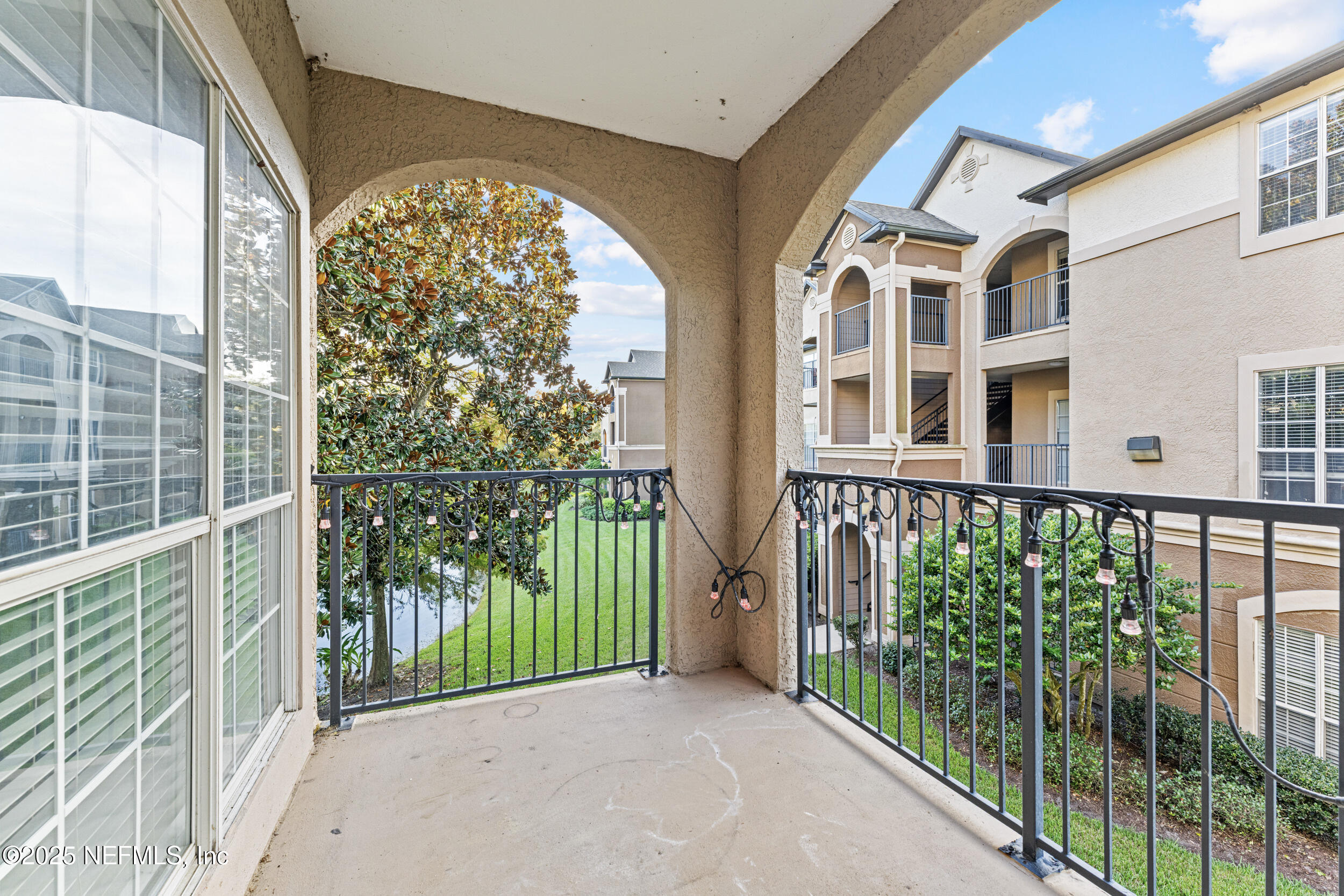 10961 Burnt Mill Road, Unit 621 Jacksonville, FL 32256 - Photo 17 of 19 a view of a building from a balcony