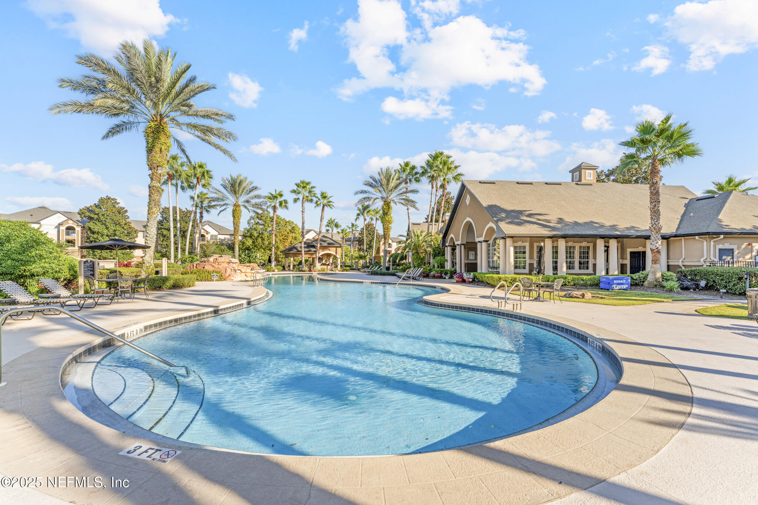 10961 Burnt Mill Road, Unit 621 Jacksonville, FL 32256 - Photo 19 of 19 a view of a swimming pool with a lounge chairs
