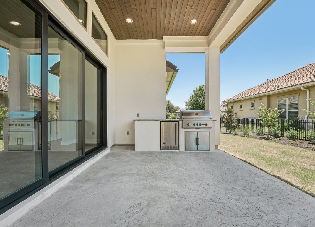 205 Indigo Lane Georgetown, TX 78628 - Photo 18 of 33 a view of a porch with a floor to ceiling window and stairs