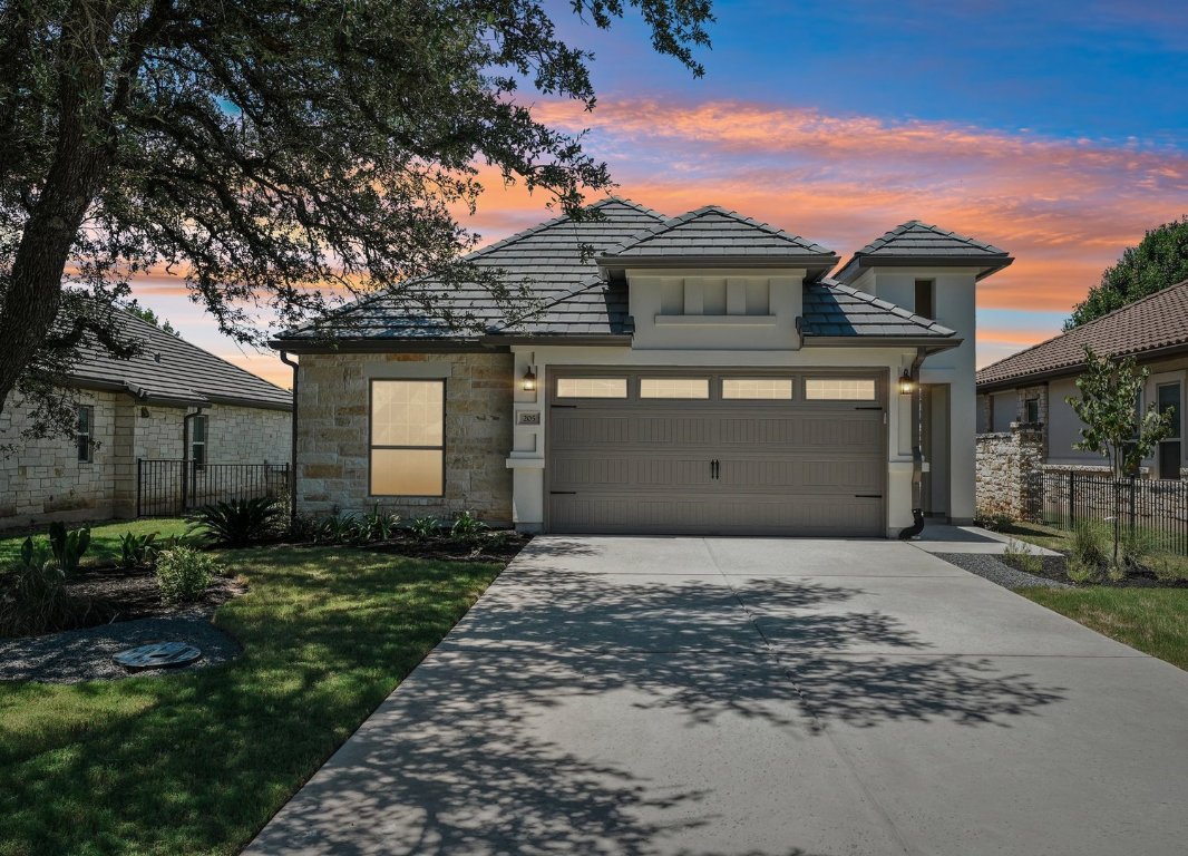 205 Indigo Lane Georgetown, TX 78628 - Photo 26 of 33 a front view of a house with a garden and yard